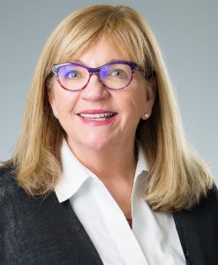 Headshot of Cathy Dinauer.