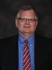 Headshot of L. Dean Fisher.